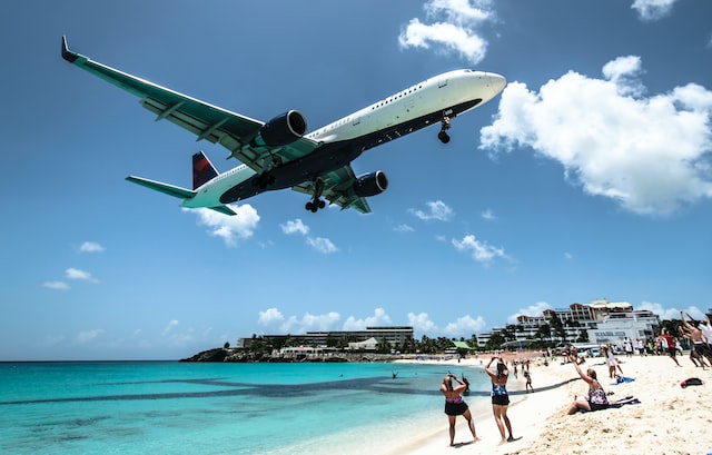 Airplane arriving to Jamaica through the beach