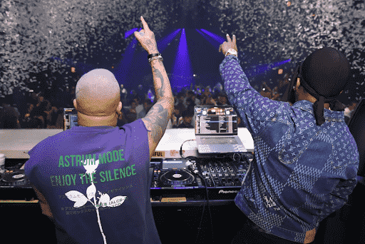 Two DJs above a crowd and confetti on Liv nightclub
