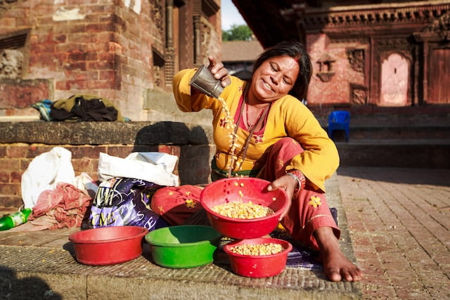 Woman washing food in Nepal